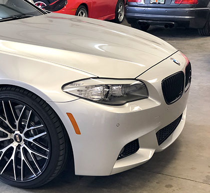 Silver BMW 7 series front quarter panel